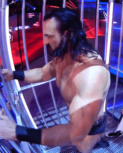 Drew McIntyre And Dominik Mysterio Locked In Cage GIF