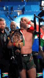 Dricus Du Plessis Wears His Belt And Flag GIF