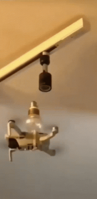 Drone Flying Over Light Bulb GIF