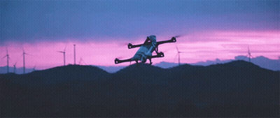 Drone Flying Over Windmill Field GIF
