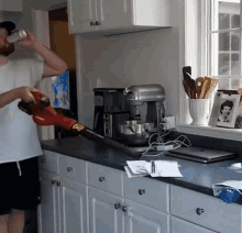 Drunk Guy Cleaning The Papers With Vacuum GIF