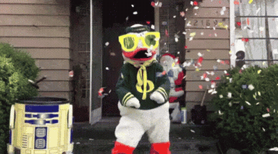 Duck Mascot Dancing With Falling Confetti GIF