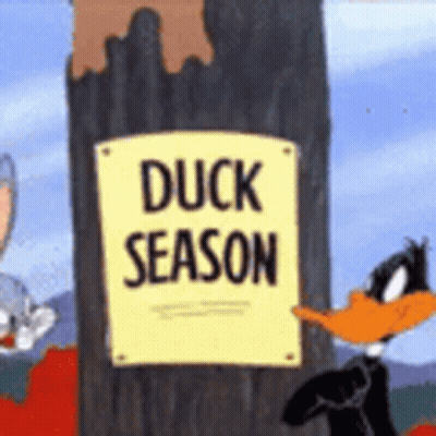 Duck Season Sign Next To Tree GIF