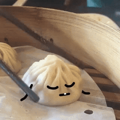 Dumpling With Face Being Eaten By Chopstick GIF