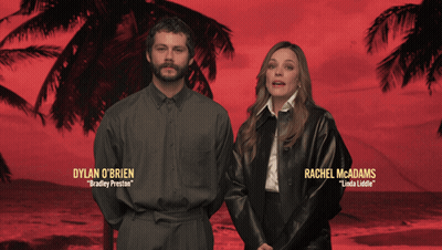 Dylan O'brien And Rachel Mcadams Are Standing Next To Each Other In Front Of Palm Trees GIF