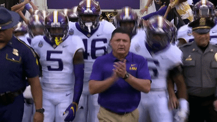 Ed Orgeron Clapping While Walking With Players GIF