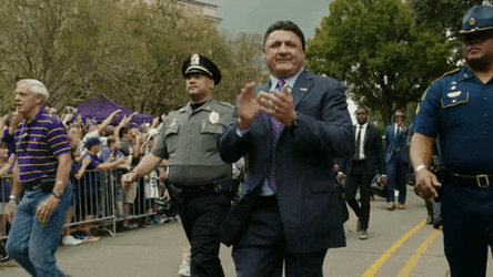 Ed Orgeron Walking With Cops On Side GIF
