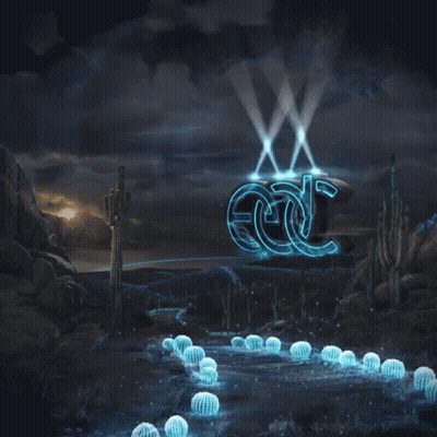 EDC Sign Lit Up In Desert GIF