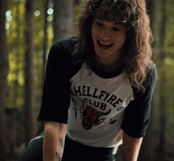 Eddie Munson Sits Down GIF