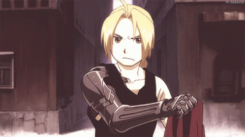Edward Elric From Full Metal Alchemist Is Standing In A Narrow Alleyway GIF