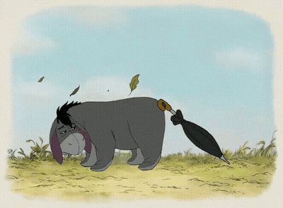 Eeyore Holding Umbrella In Mouth GIF