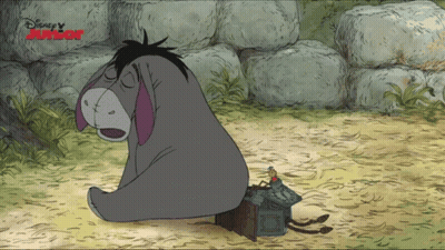 Eeyore Sitting In Dirt Next To Disney Junior Sign GIF