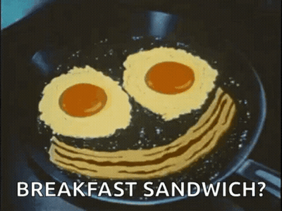 Eggs And Bacon In Smiley Face Frying Pan GIF