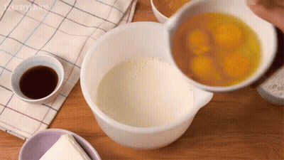 Eggs Poured Into Bowl Of Milk With Country Living Logo GIF