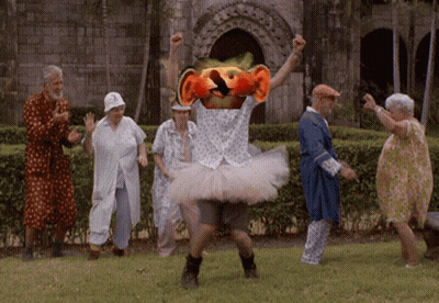 Elderly Dancing In Park With Man In Tutu GIF