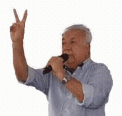Elderly Man Holding Microphone Giving Peace Sign GIF