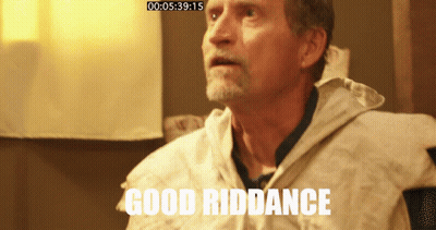 Elderly Man In Striped Apron Looking At Camera GIF