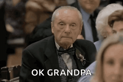 Elderly Man In Tuxedo Sitting GIF