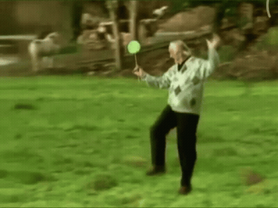 Elderly Man Playing Badminton In Park GIF