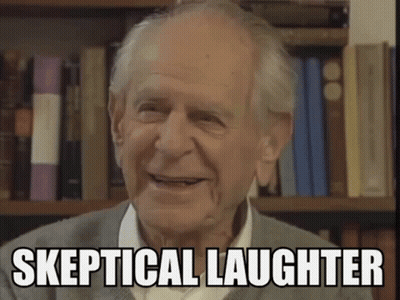 Elderly Man Smiling In Front Of Bookshelf Saying Skeptical Laughter GIF