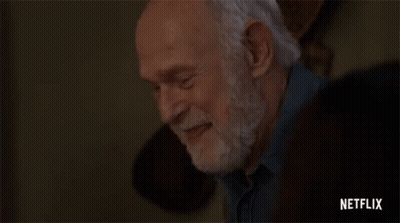 Elderly Man With Beard Hands On Forehead GIF