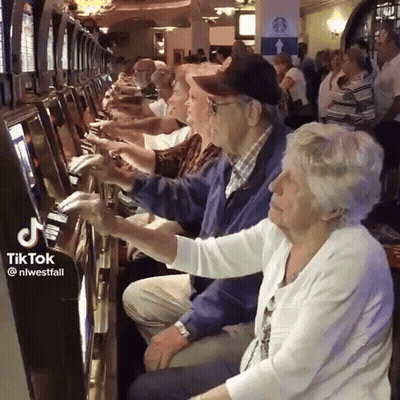 Elderly People Playing Video Game At Casino GIF