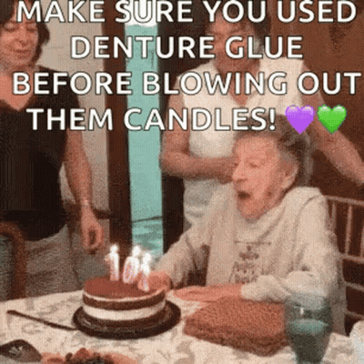 Elderly Woman Blowing Out Birthday Cake Candles GIF