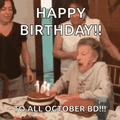 Elderly Woman Blowing Out Birthday Candles GIF
