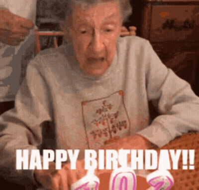 Elderly Woman Blowing Out Candle Happy Birthday GIF