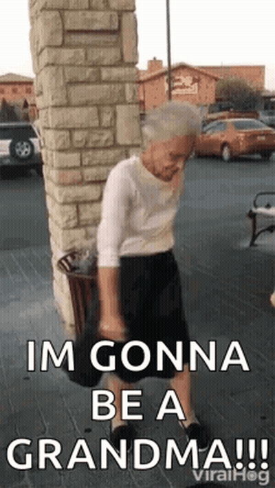 Elderly Woman Dancing On Sidewalk By Brick Building GIF
