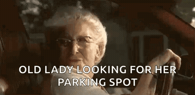 Elderly Woman Driving Car Talking To Someone GIF