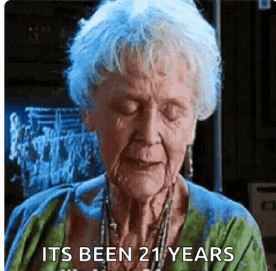 Elderly Woman Eyes Closed Saying It's Been 21 Years GIF