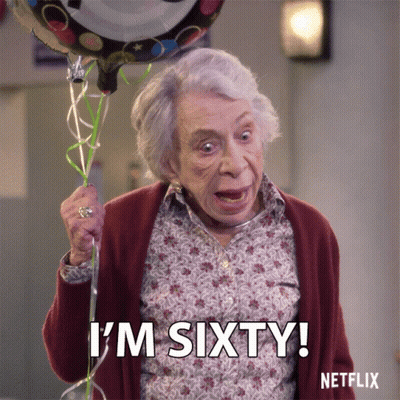 Elderly Woman Holding Birthday Balloon Says I'm Sixty GIF