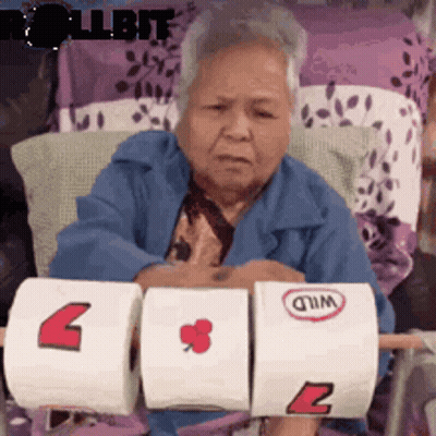 Elderly Woman Holding Toilet Paper Rolls GIF