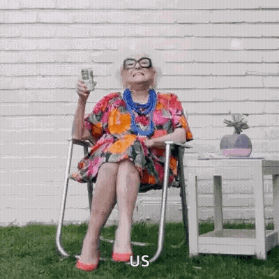 Elderly Woman Holding Wine And Stack Of Money GIF