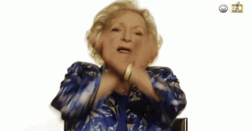 Elderly Woman In Blue Jacket Making A Face GIF