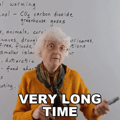 Elderly Woman In Front Of Whiteboard Saying Very Long Time GIF