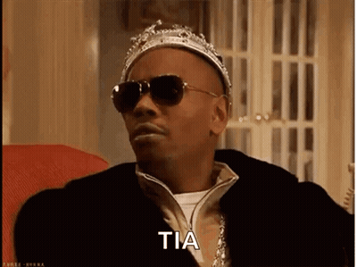 Elderly Woman In Fur Coat Holding Pink Gun Says Hi My Name Is Rizz And Im Rich GIF