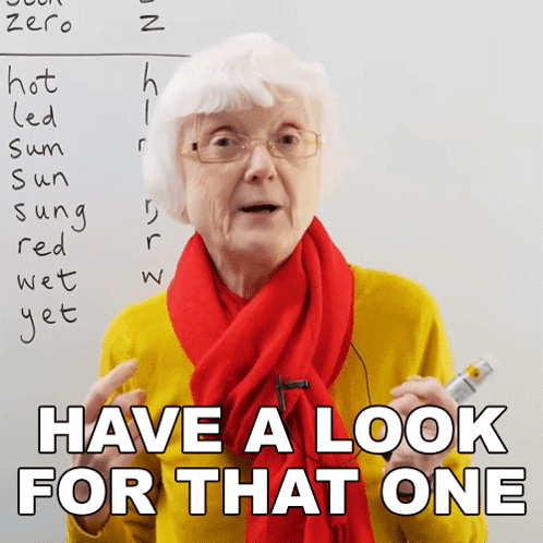 Elderly Woman In Glasses And Red Scarf Saying Have A Look For That One GIF