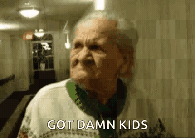 Elderly Woman In Hallway Saying Got Damn Kids GIF