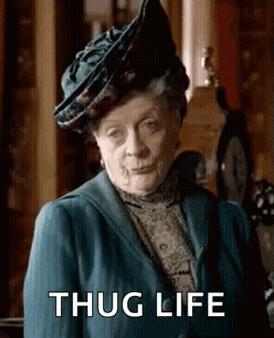 Elderly Woman In Hat And Blue Jacket GIF