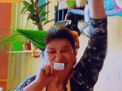Elderly Woman In Party Hat Eating Cake GIF