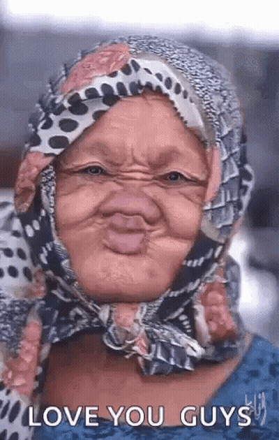 Elderly Woman In Scarf Making Funny Face GIF