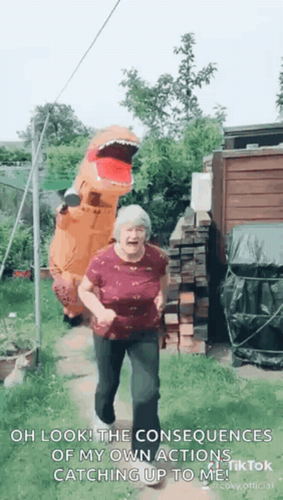 Elderly Woman In T-Rex Costume Dancing In Garden GIF