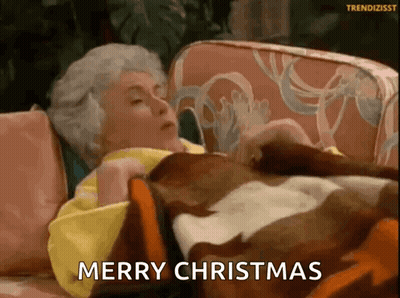 Elderly Woman Laying On Couch With Blanket Merry Christmas GIF
