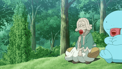 Elderly Woman Sitting In Grass With Lollipop GIF
