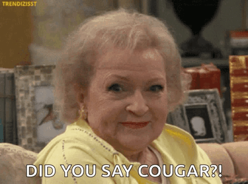 Elderly Woman Sitting On Couch Saying Did You Say Cougar GIF