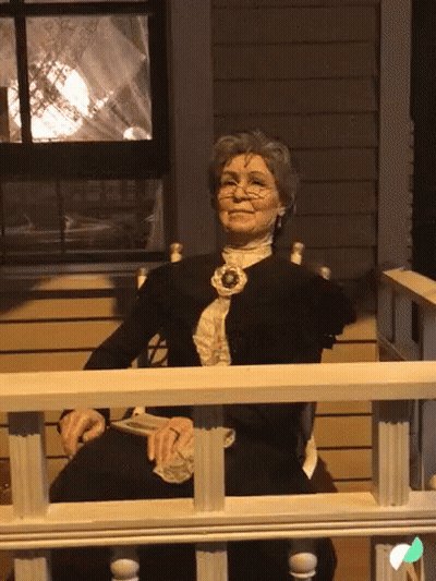 Elderly Woman Smiling On Porch GIF