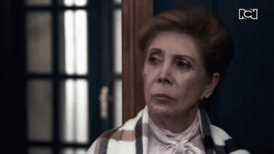 Elderly Woman Standing In Front Of Door GIF