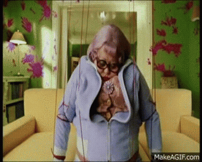 Elderly Woman Standing With Puppet GIF
